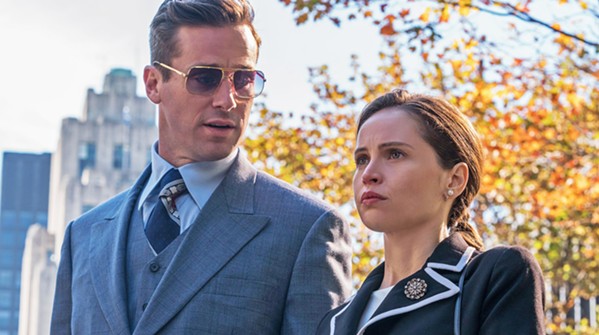 THE MAN BEHIND THE WOMAN Armie Hammer (left) stars as Martin Ginsburg, husband to now-Supreme Court Justice Ruth Bader Ginsburg (Felicity Jones, right). - PHOTOS COURTESY OF AMBLIN PARTNERS