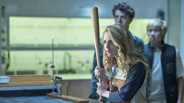 MURDEROUS FUN Tree Gelbman (Jessica Rothe, foreground) learns how she's become trapped in a time loop, reliving her murder over and over, in the satirical sequel, Happy Death Day 2U. - PHOTO COURTESY OF BLUMHOUSE PRODUCTIONS