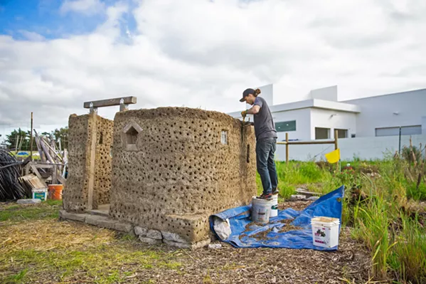 LABOR OF LOVE Although cob building is labor intensive, Franco said there's something about working with your hands from found materials that makes it all worth it. - PHOTO BY JAYSON MELLOM