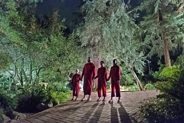 HANDS ACROSS AMERICA Evil doppelgängers menace a family in writer-director Jordan Peele's new film Us, but like his debut Get Out, this film has more on its mind than mere horror. - PHOTO COURTESY OF MONKEYPAW PRODUCTIONS