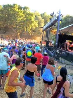 THE SHOW MUST GO ON Even though the Live Oak Music Festival is changing locations, attendees can expect the same great music and laid-back vibe that these dancers from a couple of years ago enjoyed. - FILE PHOTO BY GLEN STARKEY
