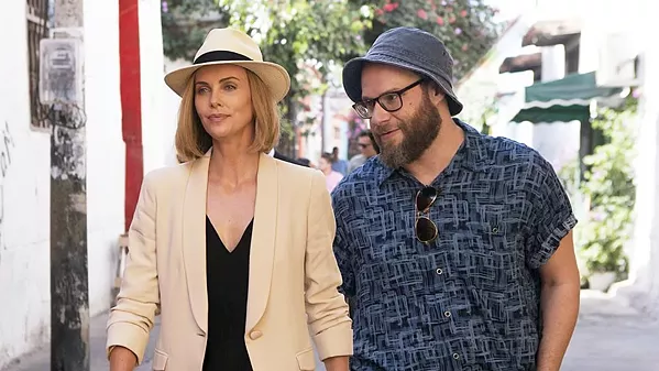BEAUTY AND THE ... FLARSKY? Frumpy journalist Fred Flarsky (Seth Rogen, right), reunites with his first crush—beautiful, ambitious, but lonely presidential hopeful Charlotte Field (Charlize Theron)—who hires him as her speechwriter, in Long Shot. - PHOTO COURTESY OF DENVER AND DELILAH PRODUCTIONS