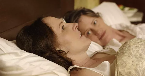 HOPE IS THE THING WITH FEATHERS Molly Shannon (foreground) stars as poet Emily Dickenson in Wild Nights with Emily, which explores her irreverent side and lifelong lesbian relationship with her sister-in-law, Susan Dickinson (Susan Ziegler). - PHOTO COURTESY OF P2 FILMS