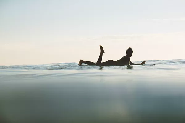 UP CLOSE While catching someone shredding a gnarly wave is all well and good, local photographer and surfer Colin Nearman prefers to capture those quiet little moments, like a lone surfer bobbing along the waves after a day spent surfing. - PHOTOS COURTESY OF COLIN NEARMAN