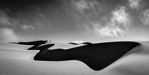 PERSPECTIVE A lone figure walks the Oceano Dunes in San Luis Obispo photographer Bob Canepa's piece, Beautiful Solitude. - PHOTO COURTESY OF BOB CANEPA