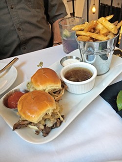 UPTOWN SLIDERS Don't you deserve Prime Rib in your sliders? These babies are dipped in au jus, topped with Swiss and onion straws, and served with your choice of fries. - PHOTOS BY BETH GIUFFRE