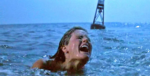 DA-DA-DA! A skinny dipper is attacked by a massive great white shark in the opening of the 1975 classic, Jaws, screening in Galaxy Theaters - PHOTO COURTESY OF UNIVERSAL PICTURES