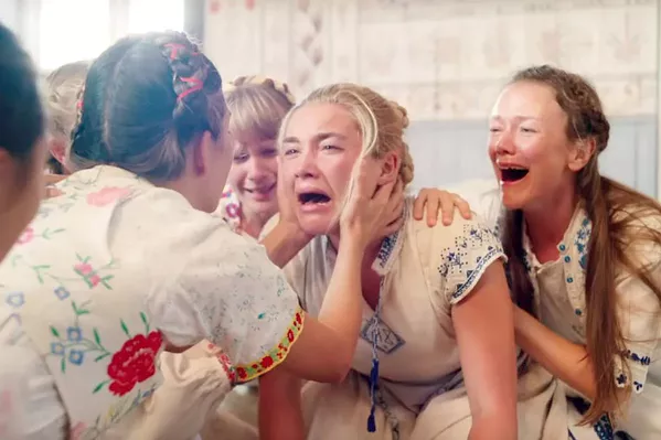 DARK SUMMER Dani (Florence Pugh, center) travels to Sweden for a festival that turns out to be run by an evil pagan cult, in the new horror film Midsommar. - PHOTO COURTESY OF B-REEL FILMS