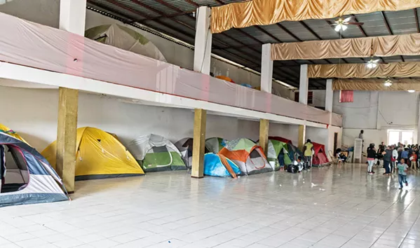 WAITING GAME In Tijuana, Mexico, there's a small church nicknamed "Little Haiti" where displaced Haitian immigrants take shelter. - PHOTO COURTESY OF BILL STRUTER