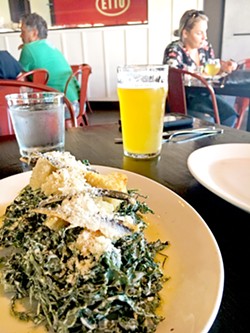 FARM-TO-TABLE FARE Walking into the Tin Canteen, you are greeted with the lovely aroma of wood-fired pizzas, rich Wagyu meatballs, herbs, and garlic. Pictured is the kale Caesar with boquerones for the table. - PHOTOS BY BETH GIUFFRE