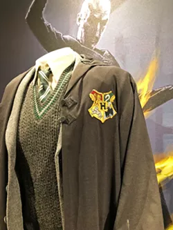 YER A WIZARD, HARRY Harry Potter's Hogwarts School of Witchcraft and Wizardry uniform is so close I could touch it ... but no touching! - PHOTOS BY GLEN STARKEY