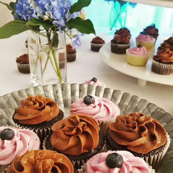 MY KIND OF MAMA Two of Cupcakes by Katie's top sellers are chocolate with salted caramel drizzle and lemon with blueberry buttercream. - PHOTOS COURTESY OF KATIE HOFFMAN