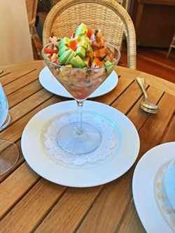 CHEERS Best served in a martini glass, the marinated shrimp ceviche is made with fresh heirloom tomatoes, cucumbers, cilantro, avocado, corn, serrano chili, and Clamato juice. - PHOTOS BY BETH GIUFFRE