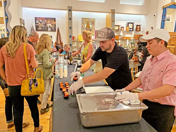 MORE PLEASE Hands Gallery had a beautiful selection of hand-crafted goods, from jewelry to clocks, to look at while munching on wraps served by Mother's Tavern. - PHOTO BY CAMILLIA LANHAM