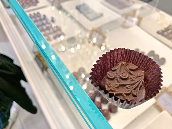 SWEET TREATS Sheila Kearns Chocolate & Confections was sampling their milk, dark, and bourbon chocolate (pictured here) treats. - PHOTO BY CAMILLIA LANHAM