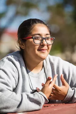 GOING FORWARD TOGETHER Dezarey Cerna feels like she's accomplishing more in school because the teachers at the charter school don't let anyone fall behind; they're always ready to help. - PHOTOS BY JAYSON MELLOM