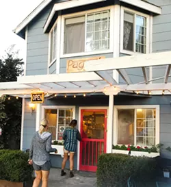 FIRST CUSTOMERS Just as the sun rises above the cypress trees in the Baywood Park neighborhood of Los Osos, two early birds walk into Pagnol to the welcoming scent of Marcus Marren's fresh-baked bread. - PHOTOS BY BETH GIUFFRE