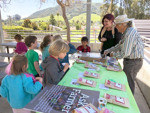 STUDENTS MEET THEIR FARMERS A big part of Director of Food Services Erin Primer's vision for San Luis Obispo County Schools is food and nutrition education. Here students learn about the food served in their cafeteria at a "Meet the Farmer" event. - PHOTO COURTESY OF ERIN PRIMER