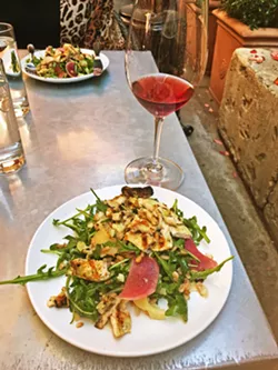 LUNCH FAVORITE One of the most popular lunch dishes on the menu is the warm grain chicken salad, served here with a lovely Thacher Working Holiday wine from Paso. - PHOTO BY BETH GIUFFRE
