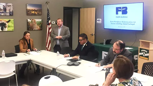 LABOR QUESTIONS Brent Burchett, (pictured standing) the executive director of the San Luis Obispo County Farm Bureau, introduces U.S. Congressman Salud Carbajal (D-Santa Barbara) to a group of local farmers and agriculture industry representatives during a Dec. 3 roundtable about modernizing the country's current guest-worker laws. - PHOTO BY WILLIAM D'URSO