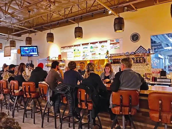 LUSH FIELDS On a recent Friday evening, Wild Fields was packed with families, couples, and a flow of customers taking bar stools to watch football and hang out. The brewhouse has only been open a month, but the word has spread far and wide. - PHOTOS BY BETH GIUFFRE