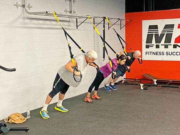 A PERSONALIZED WORKOUT MZR Fitness clients have access to personal and group training and a number of classes and programs. - PHOTO COURTESY OF MIKE ROBINSON