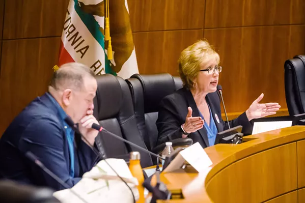 FACING OFF Stacy Korsgaden (right) debates incumbent 3rd District Supervisor Adam Hill at a Jan. 15 election forum. - PHOTO BY JAYSON MELLOM