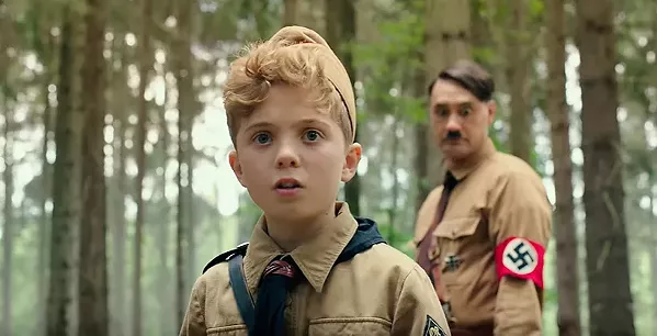 IMAGINARY FRIEND Nazi Youth member Jojo (Roman Griffin Davis, foreground) navigates the moral quandaries of Nazism with help of his imaginary friend, Adolf (Taika Waititi), in the Oscar-nominated satire, Jojo Rabbit, back in theaters. - PHOTO COURTESY OF FOX SEARCHLIGHT PICTURES