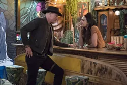 A MATCH MADE IN HELL Tallahassee (Woody Harrelson) meets Nevada (Rosario Dawson) in 2019’s hilarious horror-comedy Zombieland: Double Tap, available in Redbox. - PHOTO COURTESY OF COLUMBIA PICTURES