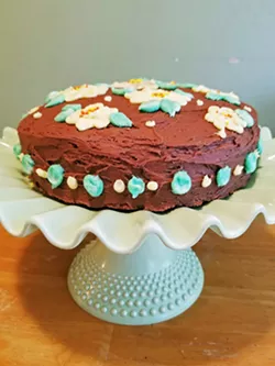 FEAST YOUR EYES A DIY craft video inspired my daughter to try a new decorating technique—which resulted in detailed spring flowers on our chocolate cake. - PHOTOS BY ANDREA ROOKS