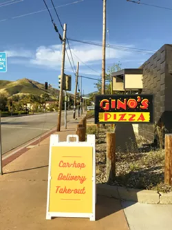 CARHOP SERVICE Gino's SLO location is now serving drive-in, carhop service. Guests can expect the classic aluminum window trays of yesteryear in this innovative solution to safe, COVID-era dining. - PHOTO BY BETH GIUFFRE