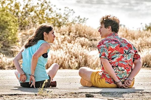STUCK ON YOU Sarah (Christin Milioti) and Nyles (Andy Sandberg) are stuck in a time loop together, forced to repeat the same day over and over, in the new comedy Palm Springs, screening on Hulu. - PHOTO COURTESY OF LIMELIGHT