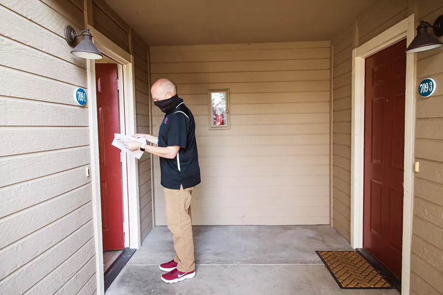 GETTING CONNECTED Attendance Officer Mick DeLeon is one of about 30 Paso Robles Joint Unified School District employees working to ensure that vulnerable students have access to online learning. That effort sometimes includes going door to door in search of students who are consistently absent. - PHOTO BY JAYSON MELLOM