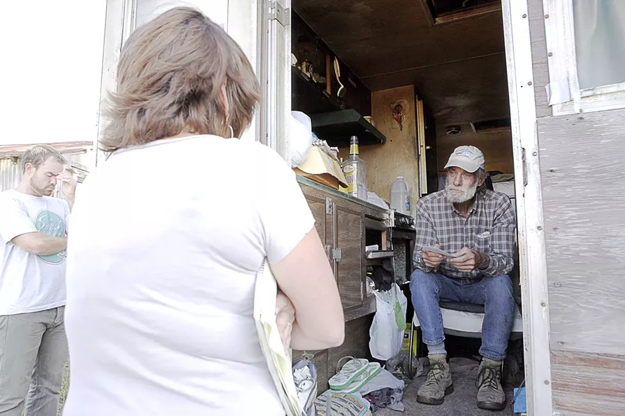 OUTSIDE LOOKING IN : A county code official informs Sunny Acres resident Peter Ray he’ll have to prepare to leave his trailer. - PHOTO BY STEVE E. MILLER