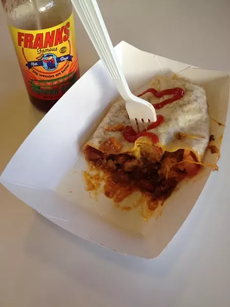 HOT DOG BURRITO: Frank’s Famous Hot Dogs might be known for its chili dog, but the lesser-ordered Mexican Dog (a chili dog wrapped in a flour tortilla) offers maximum bang for your buck. - PHOTO BY HAYLEY THOMAS