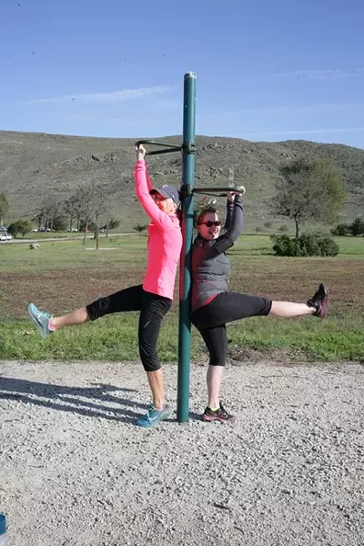 LEGS LIFTS?: UGH! Kristen Meisenheimer (left) and Anna Starkey feel the burn. - PHOTO BY GLEN STARKEY