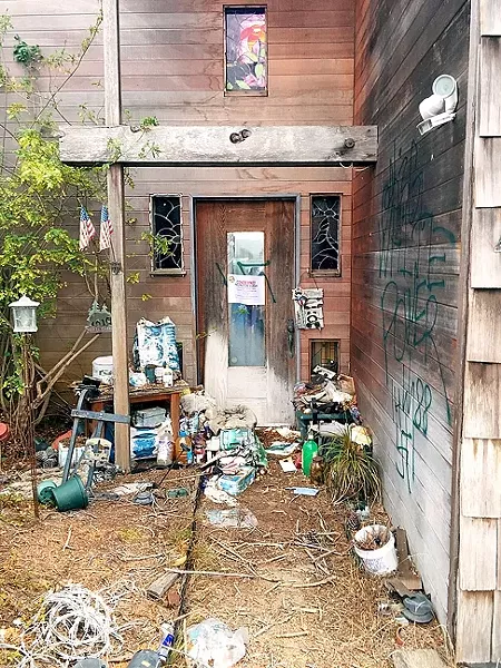VANDALIZED AND CONDEMNED: An abandoned Los Osos house vandalized with spray-painted swastikas was condemned by SLO Planning and Building on Sept. 28. - PHOTO BY PETER JOHNSON