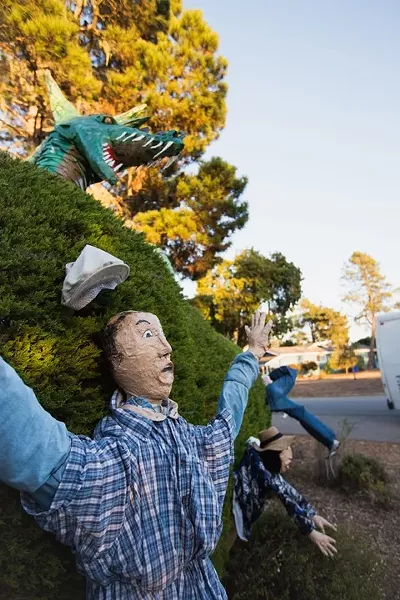 SCARE BRO: 'Hedge Creatures,' created by Haak Pearson and Sharon Vaughan and sponsored by Cambria Pines Lodge, features a towering dragon, - with scales fashioned from paper plates. - PHOTO BY KAORI FUNAHASHI