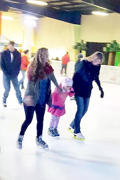 I GOT THIS (KIND OF): Oh look, there’s me (in the green jacket) in action on the ice, just about to almost wipe out. - PHOTO COURTESEY OF AQUILA CORELY