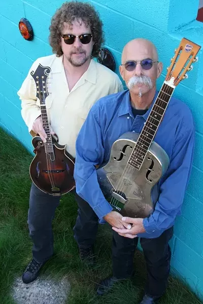 BARN RAISING: The Guttersnipes—a folky powerhouse comprised of local musicians Kenny Blackwell (mandolin), Doran Michael (guitar), Louie Ortega (guitar), and Ken Hustad (bass), will perform at the Red Barn Community Music Series in Los Osos this Saturday, Jan. 3. - PHOTO COURTESY OF KENNY BLACKWELL