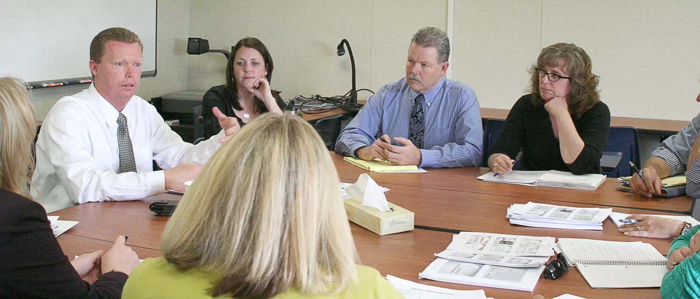 MAKING PLANS : The district’s newly selected TAP leaders, including “master teachers,” met earlier this month to discuss training. From left to right are Andy Stenson, assistant superintendent of curriculum and instruction; Kelly Logue, master teacher for Dorothea Lange Elementary; Peter Ponomaroff, Teacher Incentive Fund coordinator; and Carol Littlefield-Halfman, the district’s executive master teacher. - PHOTO BY AMY ASMAN