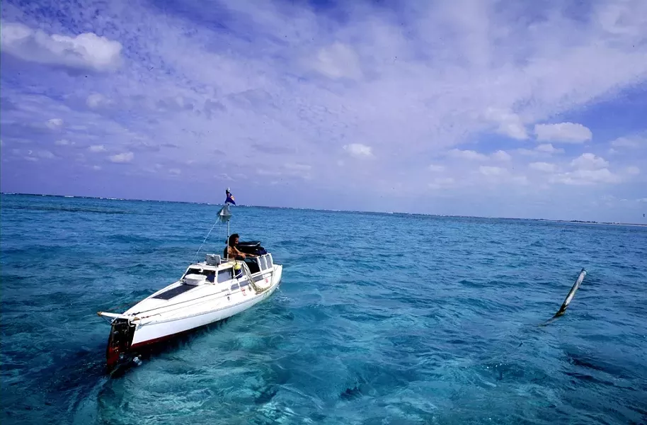 MODERN MAGELLAN : Jason Lewis, author of the The Expedition trilogy, leaves the Turks and Caicos islands in his pedal boat Moksha. - PHOTO BY KENNY BROWN