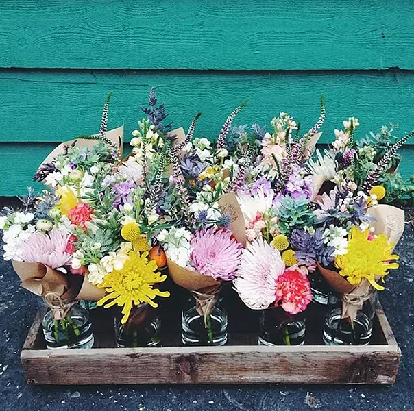 SPLENDID TABLE: Huckleberry’s custom centerpieces are known for having a more natural, gathered style. - PHOTO COURTESY OF KAREN IRWIN