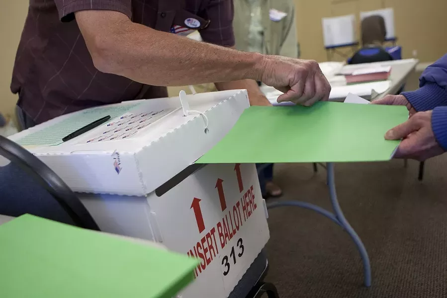VOTING MYSTERY : Ballots poured in on election night (pictured), but not everyone’s voice was heard this season. An elusive individual linked to a conservative group may be to blame for roughly 900 voter cards turned in late to the SLO County Clerk’s Office. - PHOTO BY STEVE E. MILLER