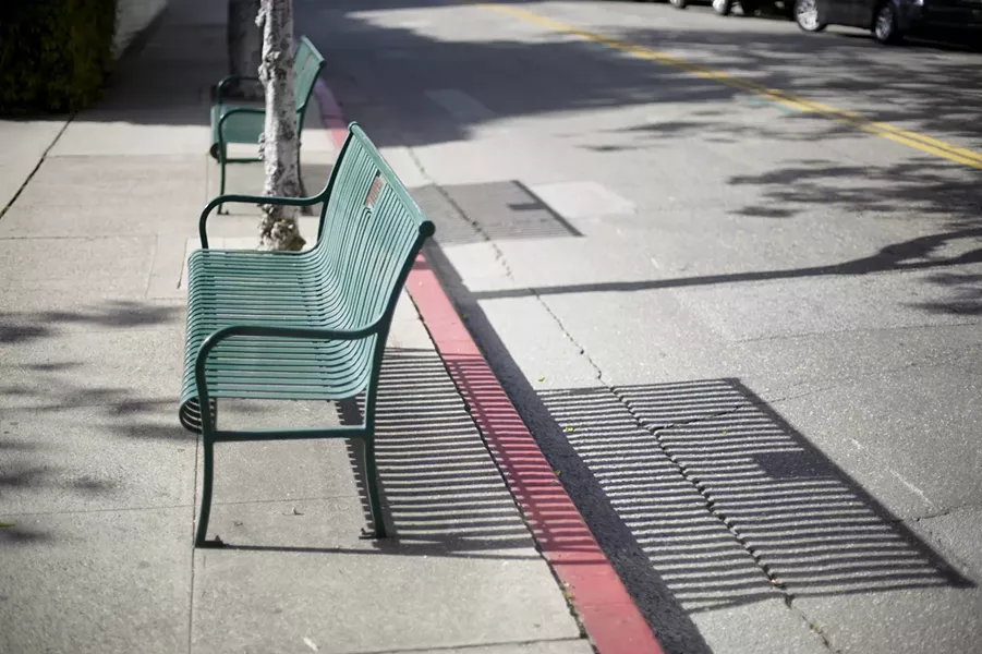 BENCHES? WE DON’T NEED NO STINKING BENCHES: According to SOFCO, removing these green park benches will help eliminate panhandling downtown. - PHOTO BY GLEN STARKEY