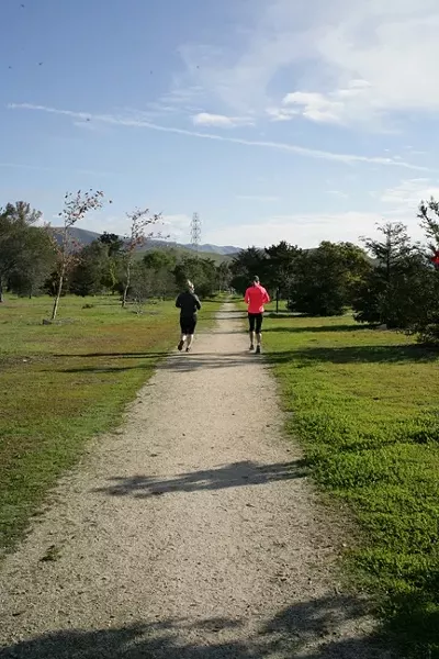 JOGGERS!: Anna and Kristen jog to the next station while Glen schleps a big camera for an added workout. - PHOTO BY GLEN STARKEY