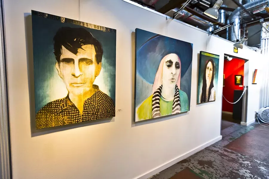 DHARMA BUM: Tom Peck layers paint and newsprint in his portrait series featuring two paintings of novelist Jack Kerouac. - PHOTO BY KAORI FUNAHASHI