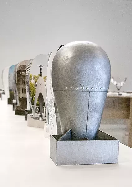 BOOKS, NOT BOMBS! : Leslie Stone’s bomb-shaped book makes a pacifist statement at this year’s “Artists’ Books exhibit,” held at the Cuesta College Art Gallery. - PHOTOS COURTESY OF DAVE PROCHASKA