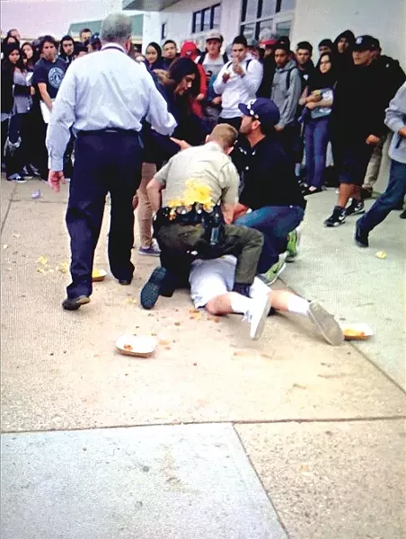CHEESE INCIDENT: After having food thrown on him by students, a deputy apprehended a student apparently involved in an altercation on Ernest Righetti High School’s campus on Nov. 19. - PHOTO COURTESY OF IVORY JONES