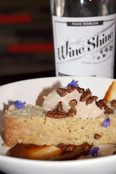 HAVE YOUR CAKE: Chef Mateo Roger’s take on tres leches is a little more boozy than average. The Hooch Cake is made with local Wine Shine, burnt caramel, and house-made buttered pecan ice cream. - PHOTO BY HAYLEY THOMAS